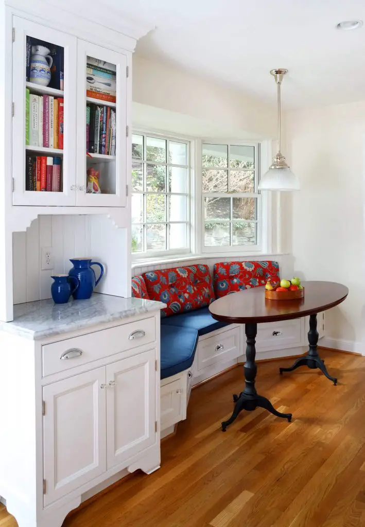 A 9 foot long banquette snakes under the bay window of this Washington, D.C., kitchen designed by Ahmann