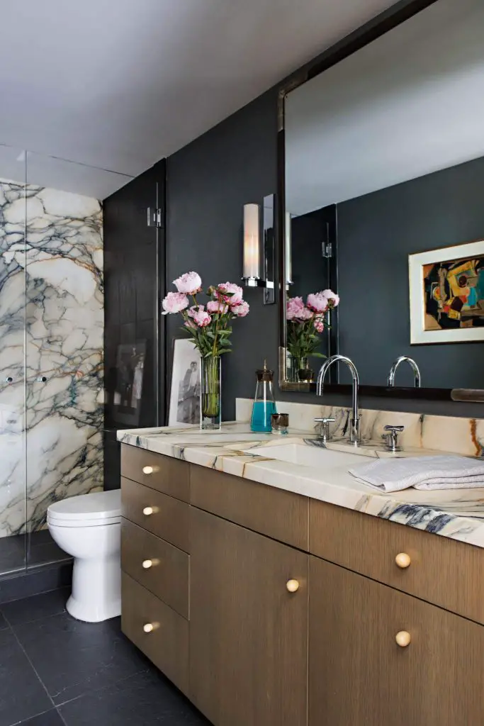 Example of a trendy black floor bathroom design in Orange County with flat panel cabinets, medium tone wood cabinets, an undermount sink and beige countertops (2)