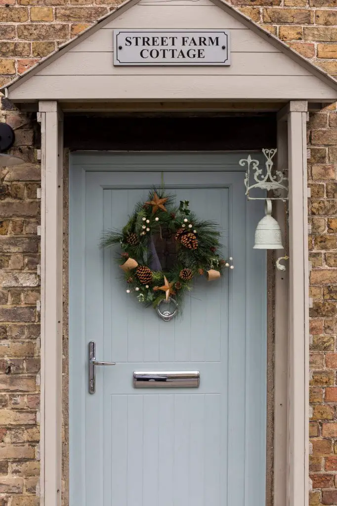 This beautiful wreath is just the right fit for this charming English cottage.